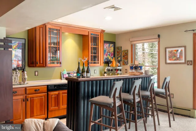 a view of a livingroom with furniture and a flat screen tv
