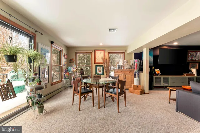 a view of a workspace with furniture and toys