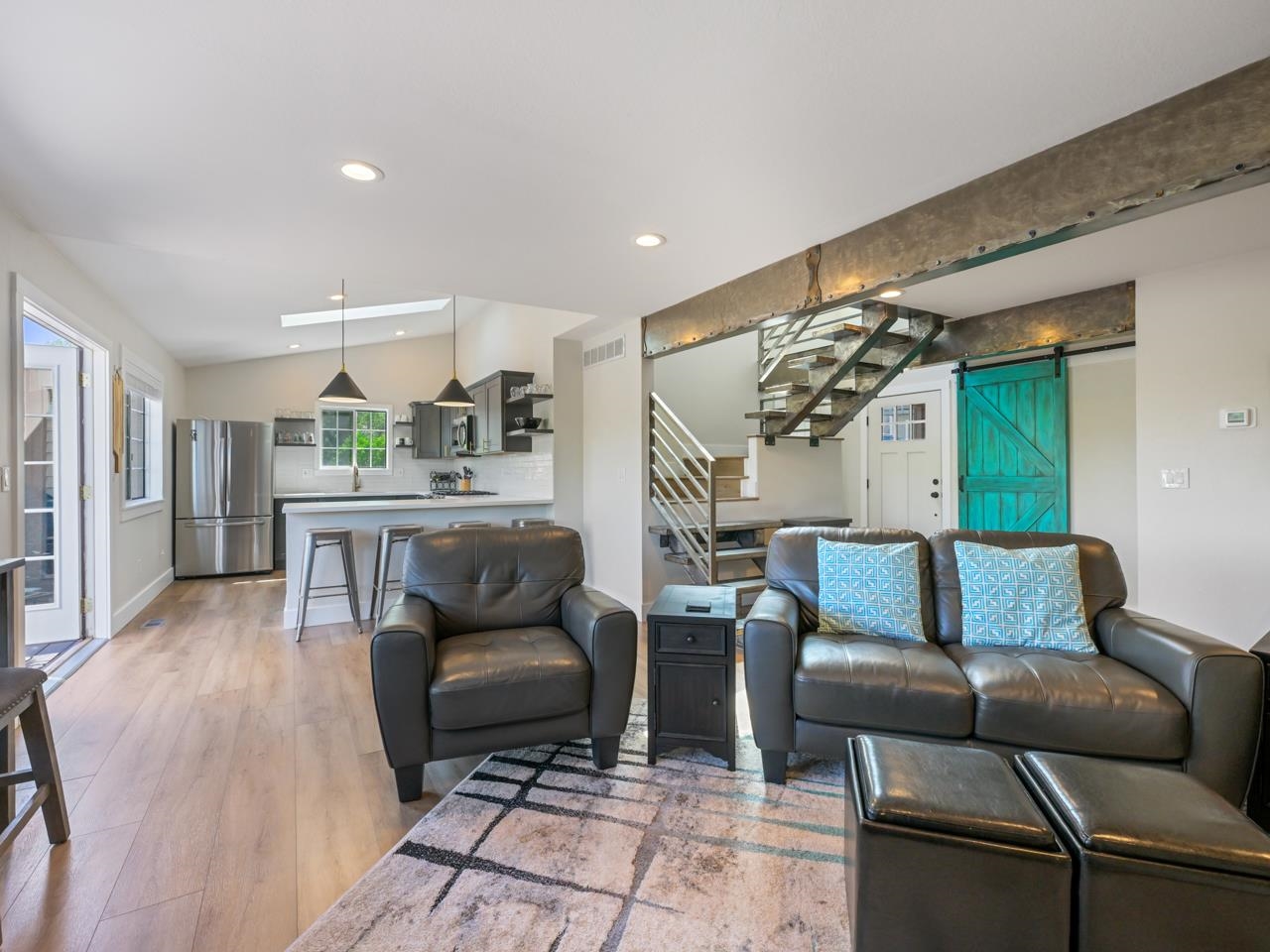 383 Explorer Court, Unit B Grand Junction, CO 81507 - Photo 7 of 40 a living room with furniture and a rug