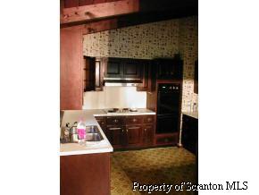 2016 Rr1 Nicholson, PA 18441 - Photo 5 of 5 a kitchen with a stove and a refrigerator