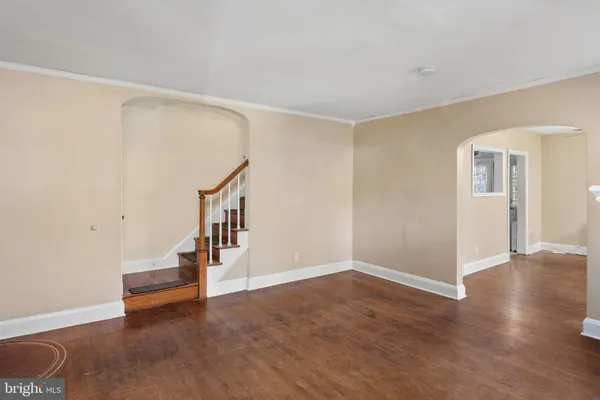 a view of a livingroom with an empty space and a fireplace