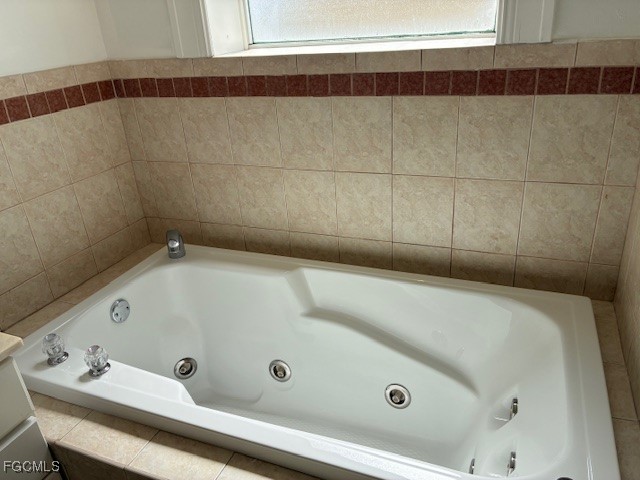 2310 First Street, Unit 703 Fort Myers, FL 33901 - Photo 17 of 28 a bathroom with a tub and a shower