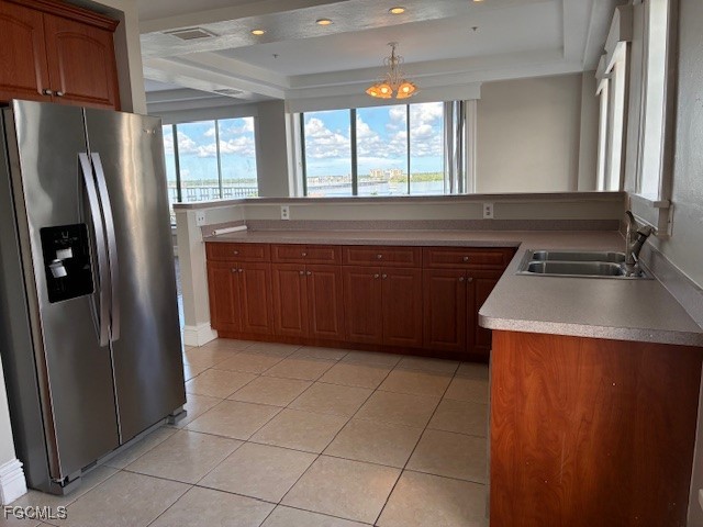 2310 First Street, Unit 703 Fort Myers, FL 33901 - Photo 22 of 28 a kitchen with stainless steel appliances granite countertop a refrigerator and a sink