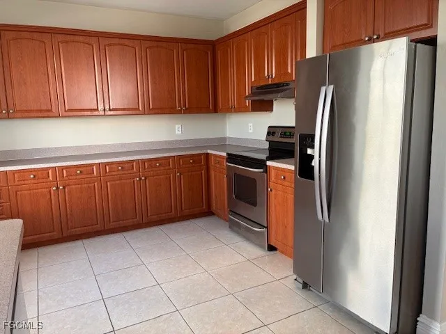 a kitchen with a sink and a window