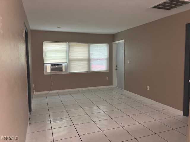 2310 First Street, Unit 703 Fort Myers, FL 33901 - Photo 28 of 28 a view of an empty room with window and chandelier fan