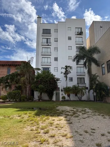 a view of a building with a yard