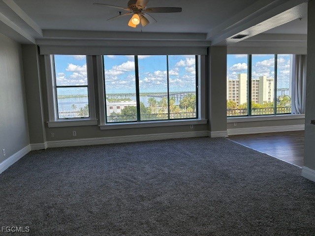 2310 First Street, Unit 703 Fort Myers, FL 33901 - Photo 7 of 28 an empty room with a fireplace and large windows