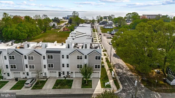 a view of multiple houses with a yard