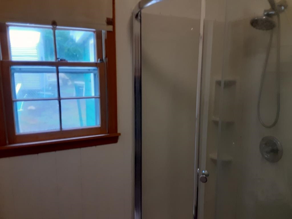 338 Desert Road Reva, VA 22735 - Photo 9 of 10 a bathroom with a glass shower door