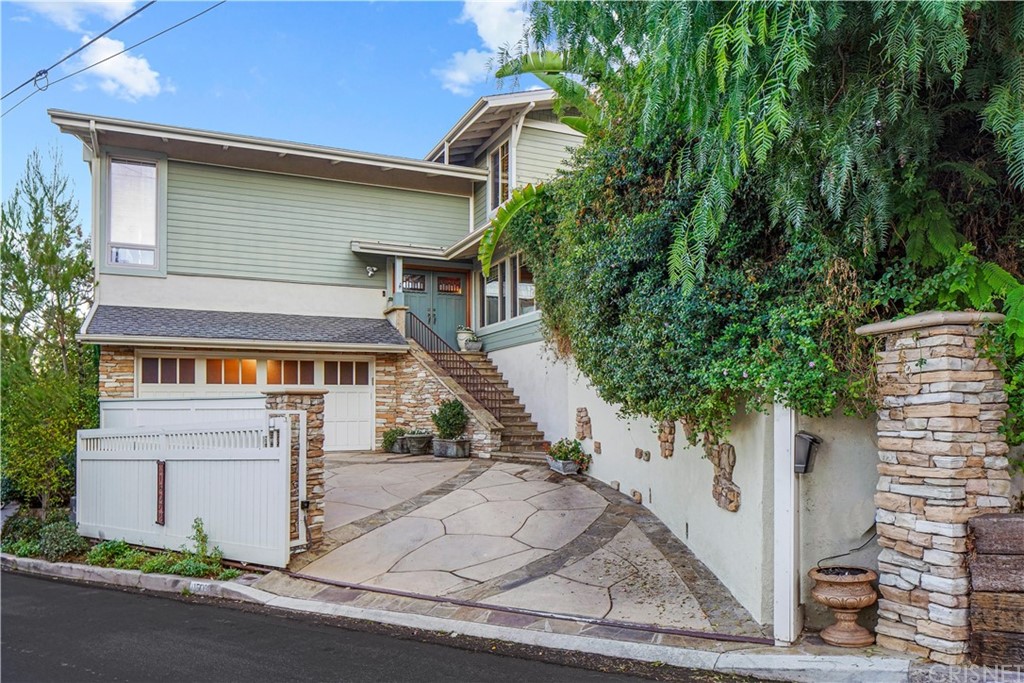 15098 Rayneta Drive Sherman Oaks, CA 91403 - Photo 2 of 43 a front view of a house with a yard and trees