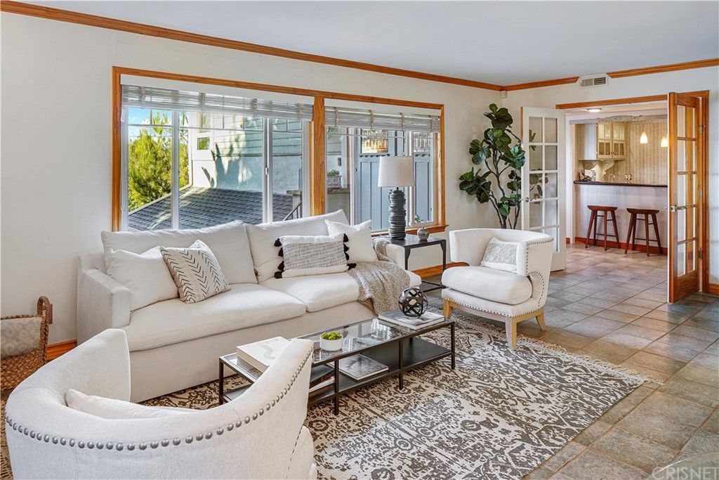 15098 Rayneta Drive Sherman Oaks, CA 91403 - Photo 13 of 43 a living room with furniture and a large window