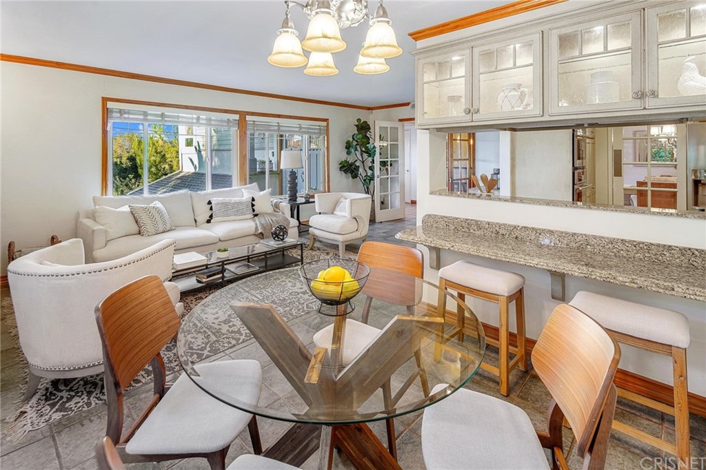15098 Rayneta Drive Sherman Oaks, CA 91403 - Photo 14 of 43 a living room with furniture and a large window