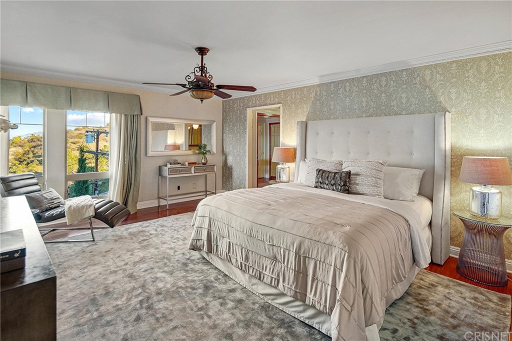 15098 Rayneta Drive Sherman Oaks, CA 91403 - Photo 22 of 43 a bedroom with a bed and wooden floor