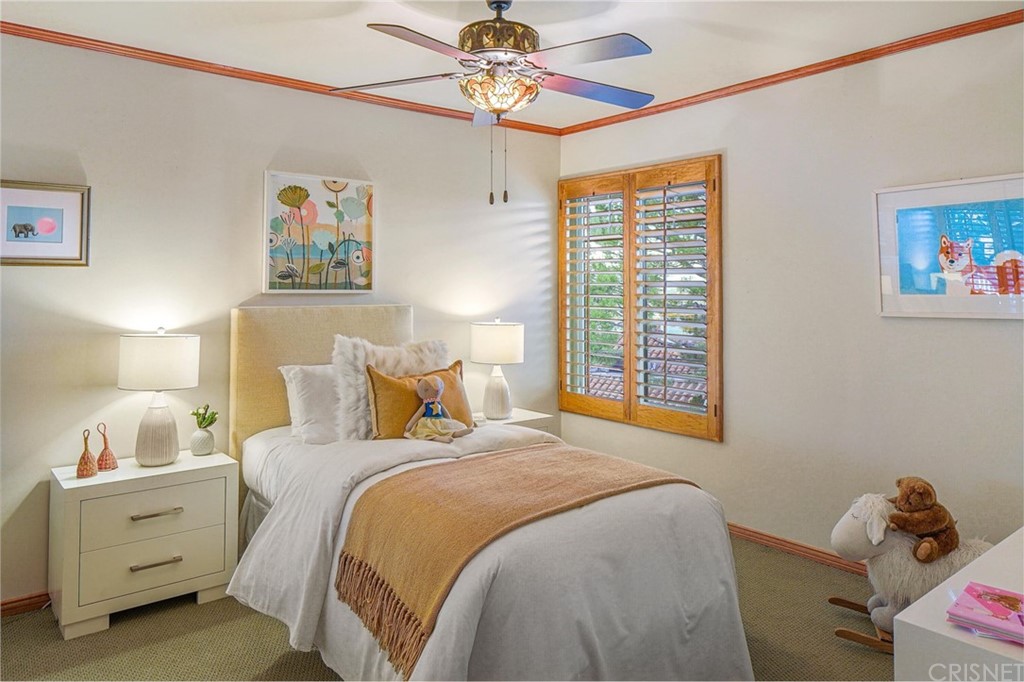 15098 Rayneta Drive Sherman Oaks, CA 91403 - Photo 26 of 43 a bedroom with a bed and a window