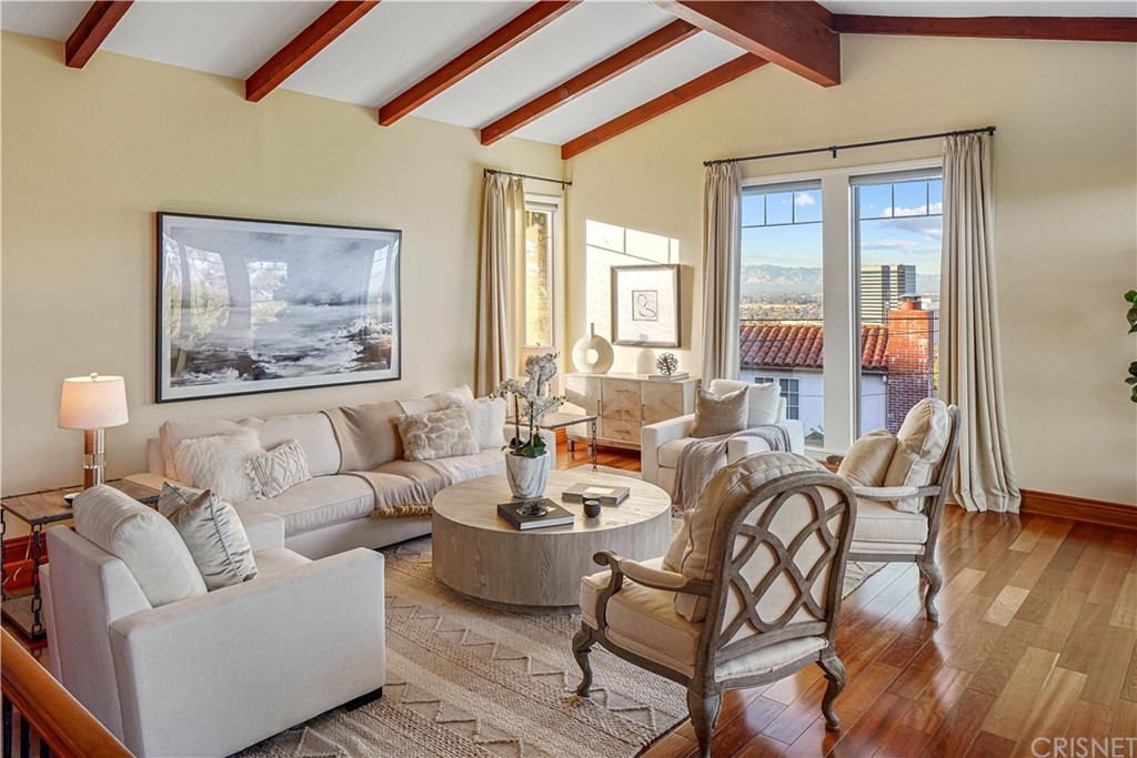 15098 Rayneta Drive Sherman Oaks, CA 91403 - Photo 4 of 43 a living room with furniture and a large window