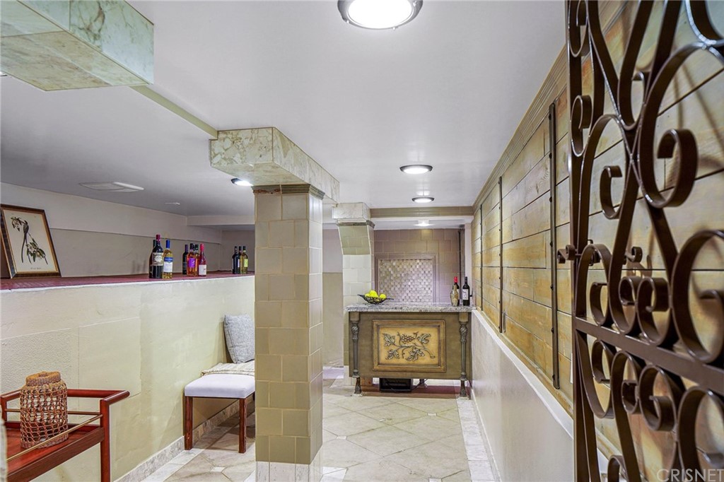 15098 Rayneta Drive Sherman Oaks, CA 91403 - Photo 31 of 43 a living room with furniture and a flat screen tv