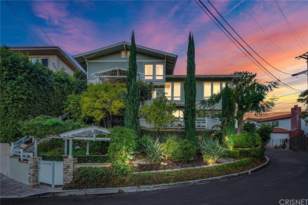 15098 Rayneta Drive Sherman Oaks, CA 91403 - Photo 41 of 43 a front view of a house with yard and green space
