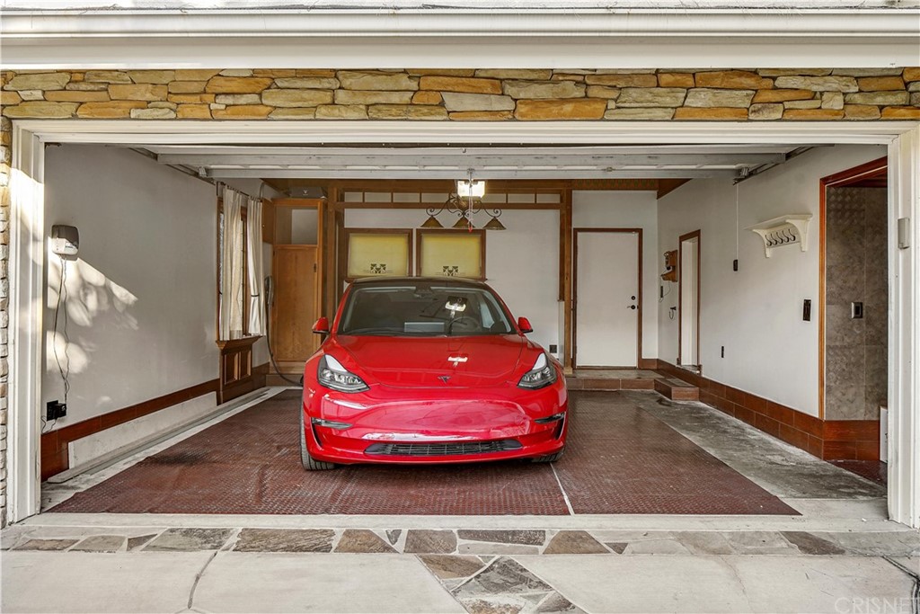 15098 Rayneta Drive Sherman Oaks, CA 91403 - Photo 42 of 43 a front view of a house with a red gate