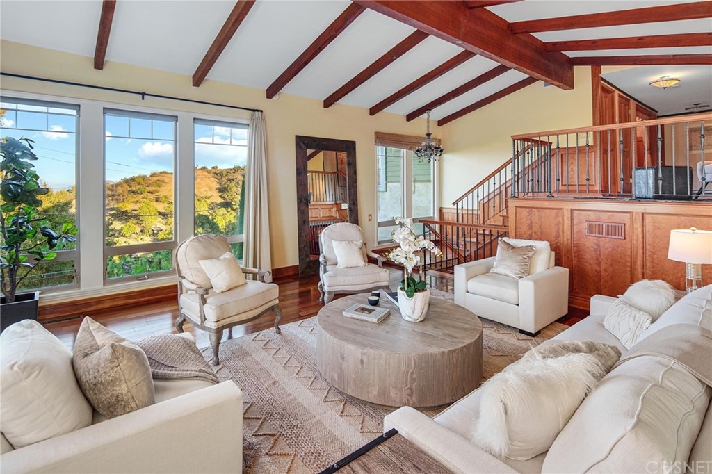 15098 Rayneta Drive Sherman Oaks, CA 91403 - Photo 6 of 43 a living room with furniture and a large window
