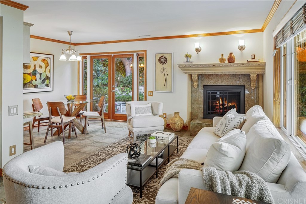 15098 Rayneta Drive Sherman Oaks, CA 91403 - Photo 9 of 43 a living room with furniture and a fireplace