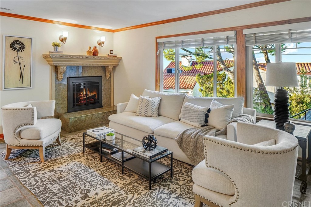 15098 Rayneta Drive Sherman Oaks, CA 91403 - Photo 10 of 43 a living room with furniture and a fireplace