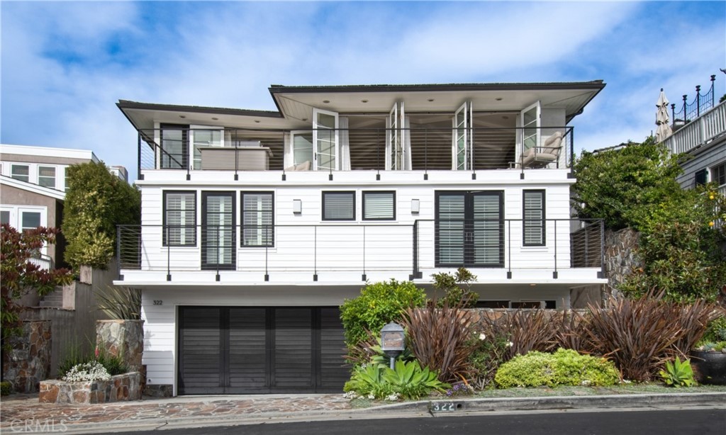 322 Emerald Bay Laguna Beach, CA 92651 - Photo 1 of 34 a view of a large building with a window and balcony