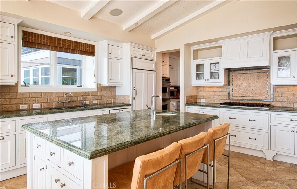 322 Emerald Bay Laguna Beach, CA 92651 - Photo 12 of 34 a kitchen with granite countertop a sink and a stove