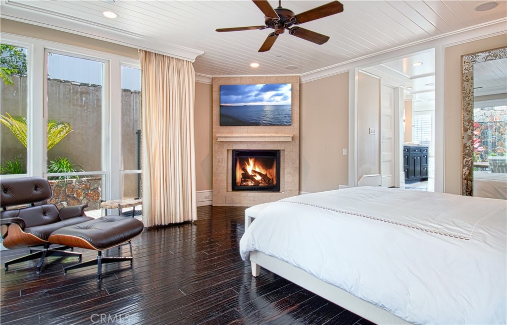 322 Emerald Bay Laguna Beach, CA 92651 - Photo 14 of 34 a bed room with a bed and a fireplace