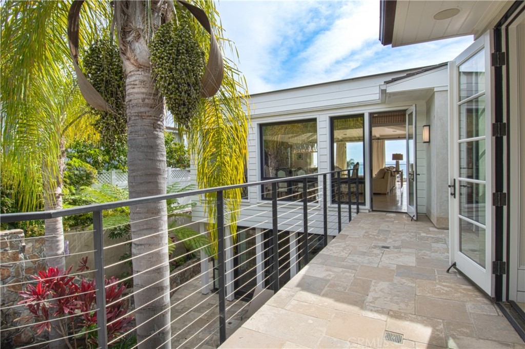 322 Emerald Bay Laguna Beach, CA 92651 - Photo 17 of 34 a view of balcony with wooden floor and a potted plant