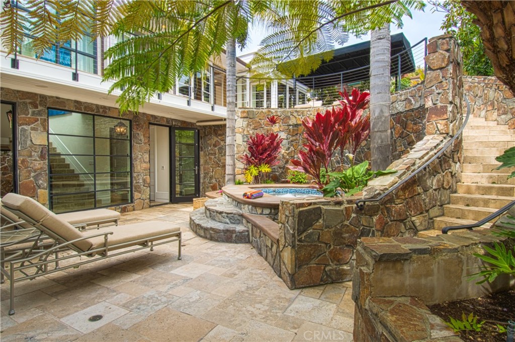 322 Emerald Bay Laguna Beach, CA 92651 - Photo 19 of 34 a view of a chairs and table in the patio