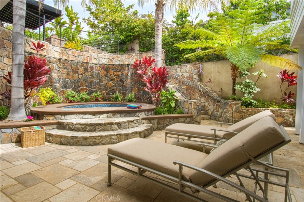 322 Emerald Bay Laguna Beach, CA 92651 - Photo 20 of 34 a view of backyard with seating space and trees