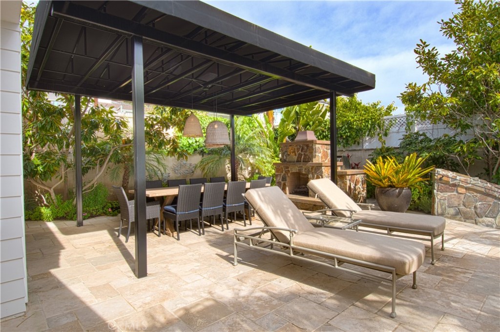 322 Emerald Bay Laguna Beach, CA 92651 - Photo 21 of 34 a view of a patio with table and chairs under an umbrella