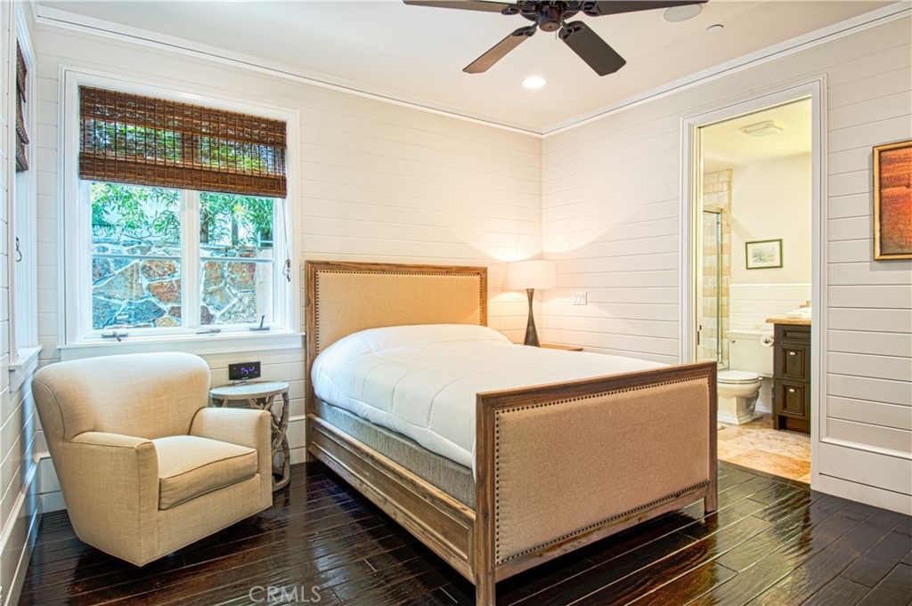 322 Emerald Bay Laguna Beach, CA 92651 - Photo 27 of 34 a bed room with a bed and a couch