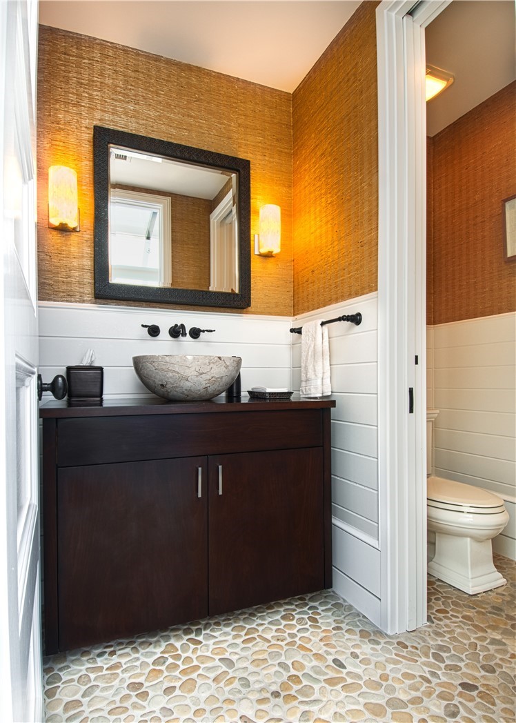 322 Emerald Bay Laguna Beach, CA 92651 - Photo 31 of 34 a bathroom with a sink and a mirror