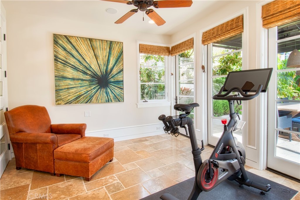 322 Emerald Bay Laguna Beach, CA 92651 - Photo 32 of 34 a living room with furniture a flat screen tv and a large window
