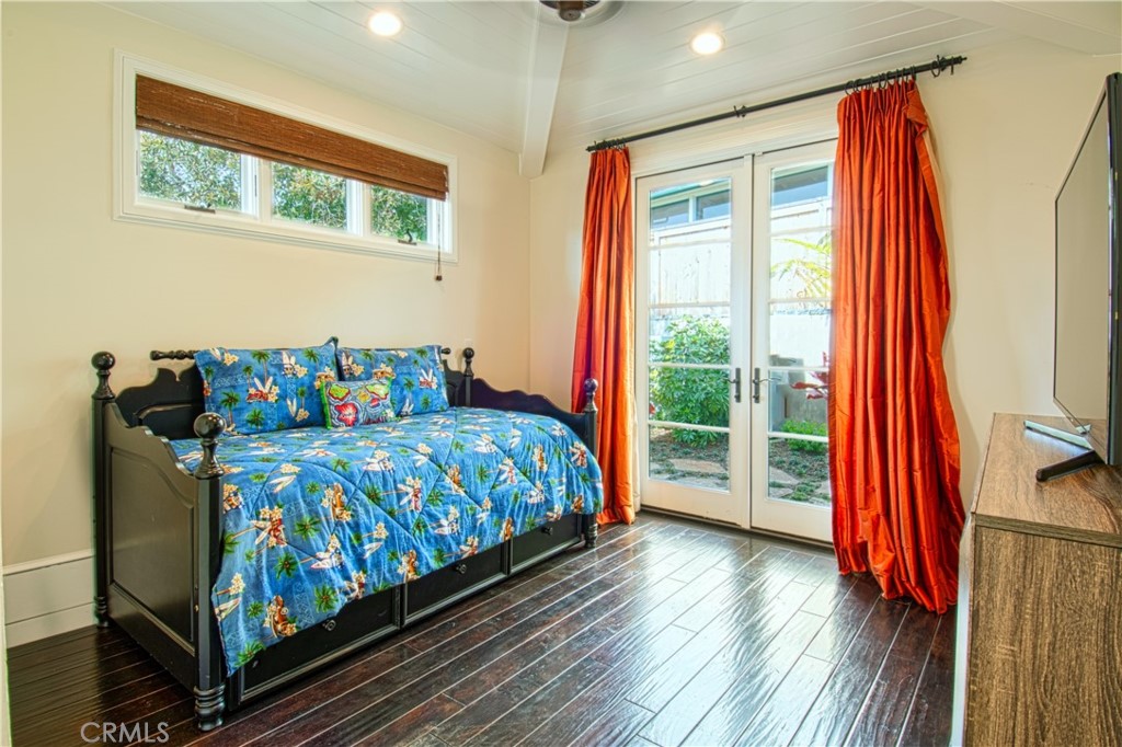 322 Emerald Bay Laguna Beach, CA 92651 - Photo 33 of 34 a bedroom with a bed and wooden floor