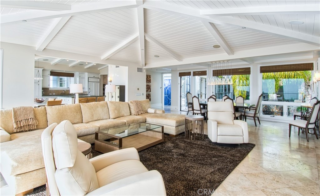 322 Emerald Bay Laguna Beach, CA 92651 - Photo 7 of 34 a living room with furniture wooden floor and a large window