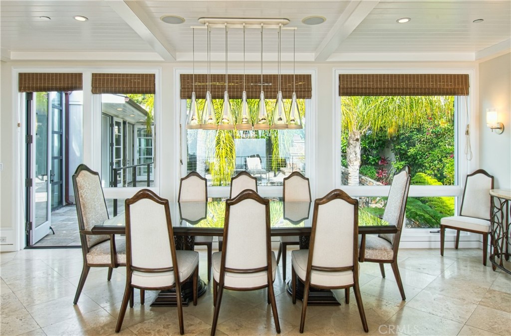 322 Emerald Bay Laguna Beach, CA 92651 - Photo 9 of 34 a view of a dining room with furniture and a large window