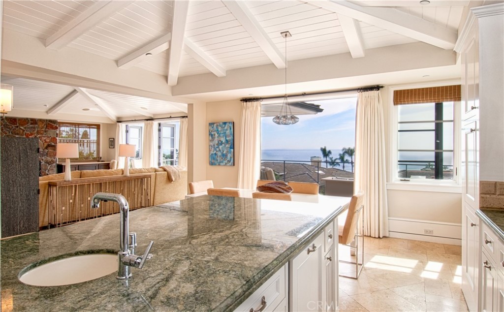 322 Emerald Bay Laguna Beach, CA 92651 - Photo 10 of 34 a kitchen with granite countertop a sink and cabinets