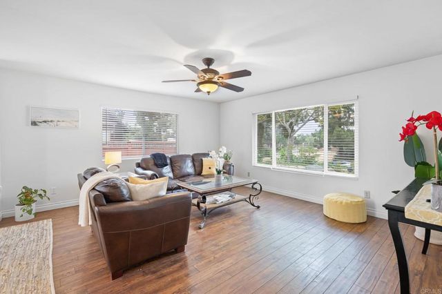 a living room with furniture and window