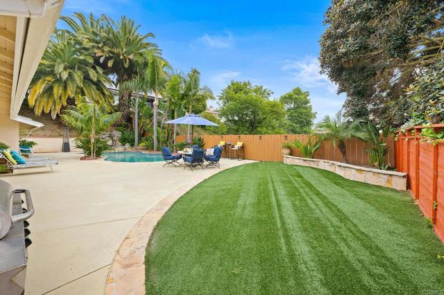 a view of a swimming pool with a patio