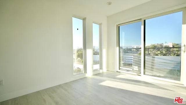 a view of a room with a large window