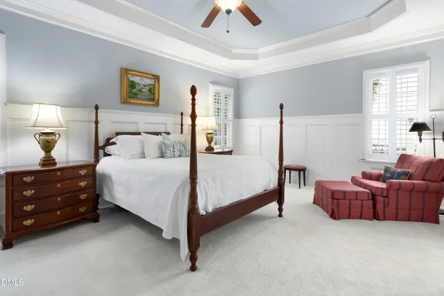 a bedroom with bed and window