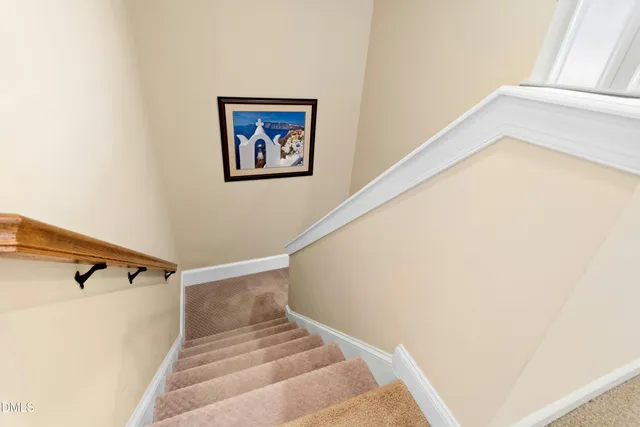 a view of a hallway with staircase