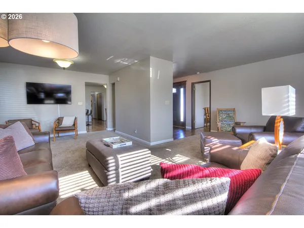 a kitchen with stainless steel appliances granite countertop a refrigerator and a stove
