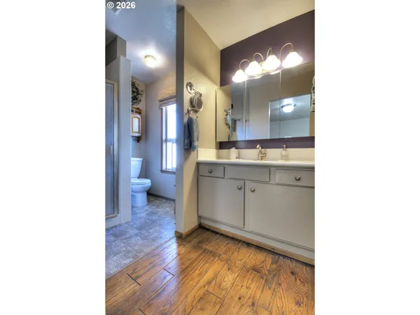 a en suite bathroom with a sink and mirror