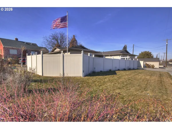 an aerial view of a house with a swimming pool