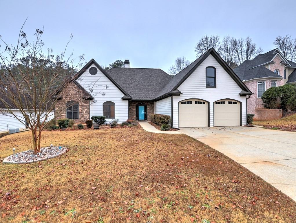 3221 Summer Stream Lane Kennesaw, GA 30152 - Photo 1 of 20 a front view of a house with a yard