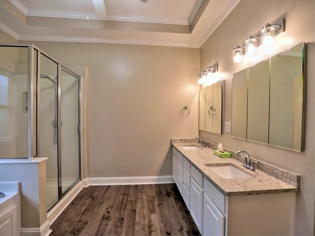 3221 Summer Stream Lane Kennesaw, GA 30152 - Photo 13 of 20 a bathroom with a granite countertop sink a mirror and a shower