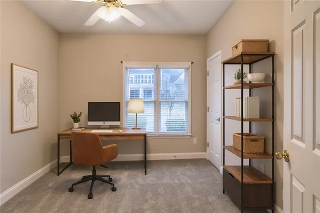 a bathroom with a granite countertop sink toilet and a mirror